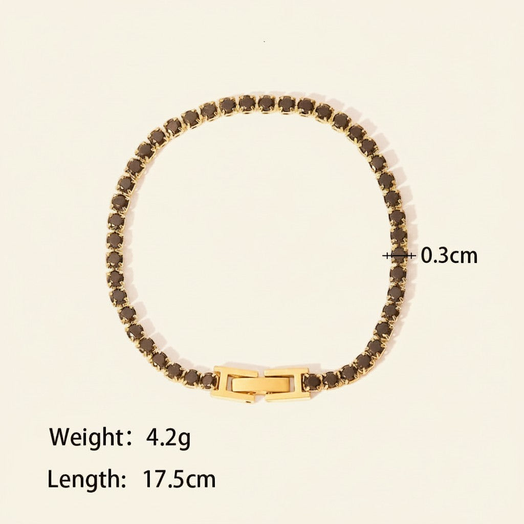 Seraphina Treasures Albina bracelet with black crystal zircon accents and gold-tone clasp. 17.5cm length.