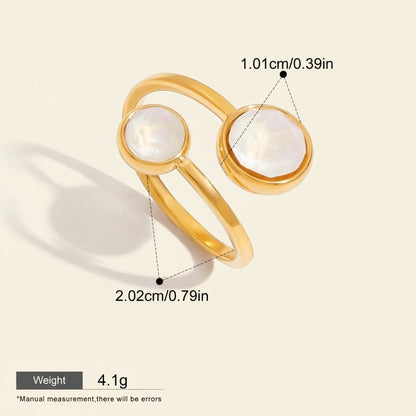 Seraphina Treasures Calyra gold ring with two white mother-of-pearl inlays, geometric design.