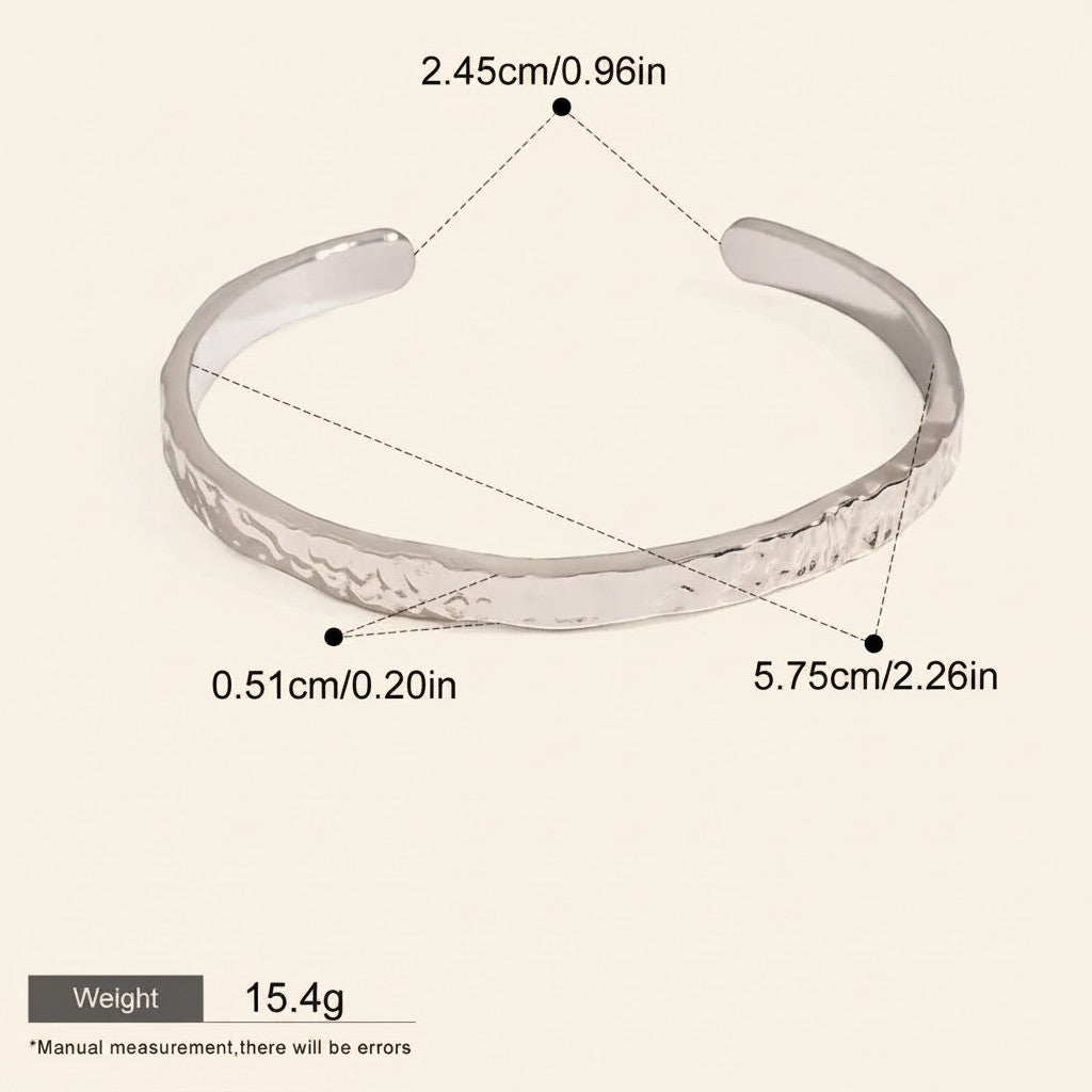 Seraphina Treasures Cyrine silver-tone metal open bangle with hammered texture. Waterproof and hypoallergenic.