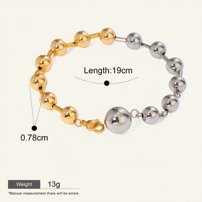 Seraphina Treasures Elara bracelet with gold and silver tone beads, 19cm length, waterproof and hypoallergenic.