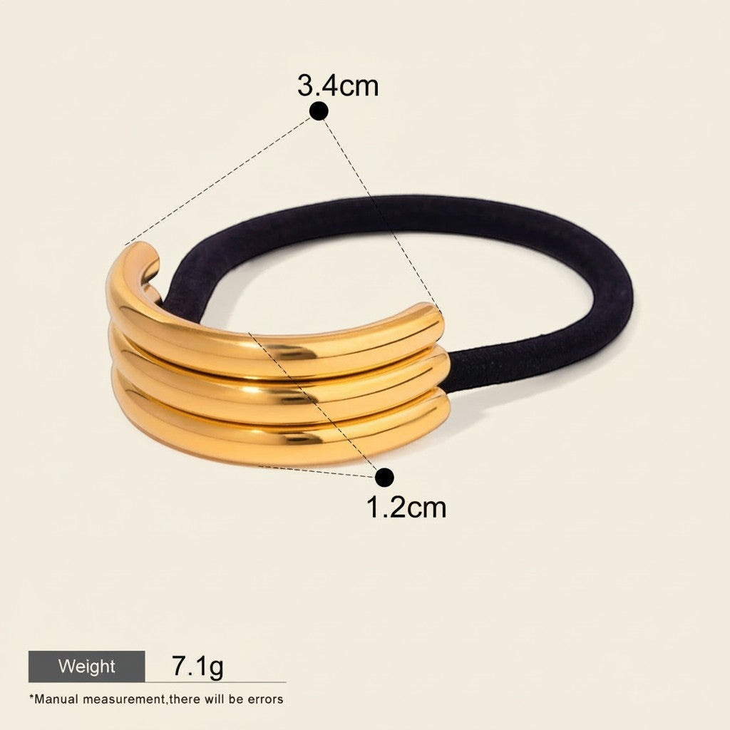 Seraphina Treasures Glintara gold multi-layer hollow U-shaped hair accessory on black elastic band.