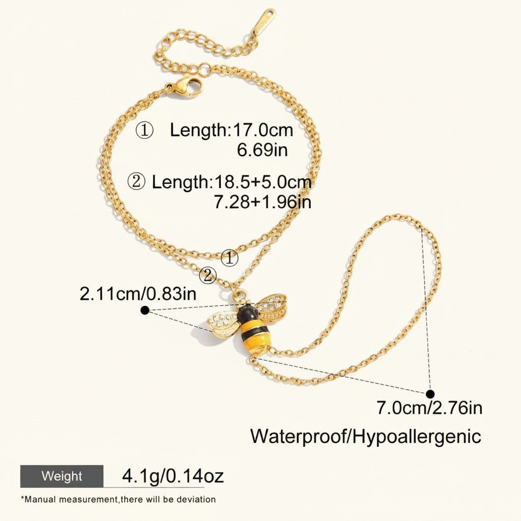 Seraphina Treasures gold-tone bracelet with a bee charm, featuring zircon accents and yellow and black enamel.
