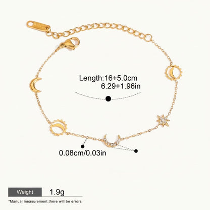 Seraphina Treasures gold-tone bracelet with moon, sun, and star charms, featuring diamond-like accents.