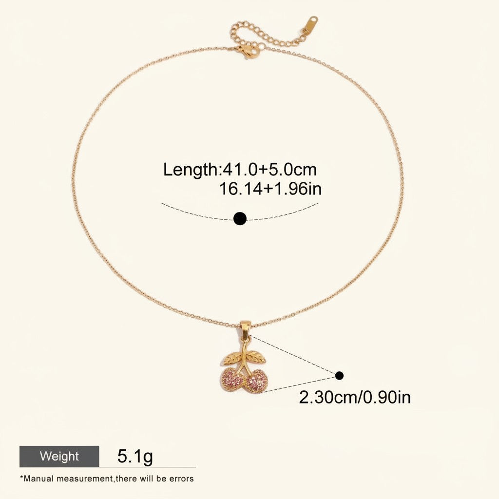 Seraphina Treasures gold necklace with a cherry pendant adorned with pink cubic zirconia stones.