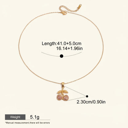 Seraphina Treasures gold necklace with a cherry pendant adorned with pink cubic zirconia stones.