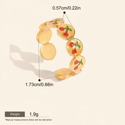 Seraphina Treasures gold-tone adjustable ring with red cherry enamel details and open design.