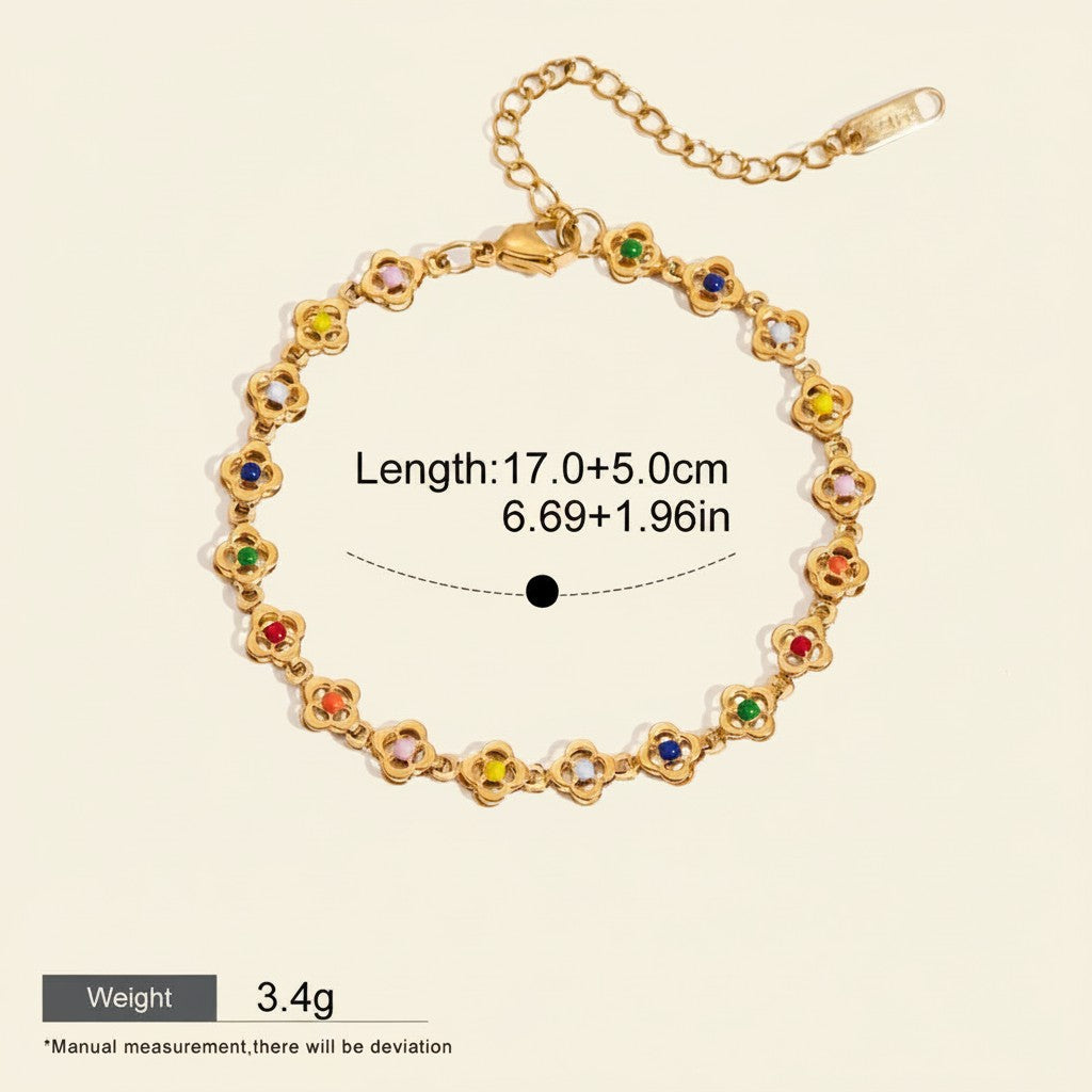 Seraphina Treasures gold-tone bracelet with colorful flower-shaped charms and adjustable chain. Waterproof and hypoallergenic.