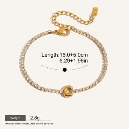 Seraphina Treasures gold-tone bracelet with clear zirconia stones and a gold 'C' initial pendant. Adjustable chain.