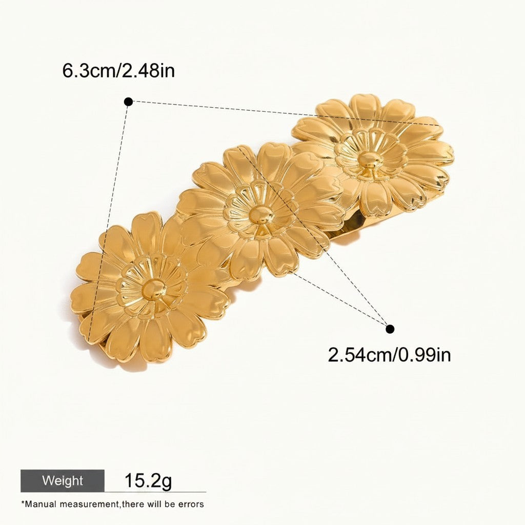 Seraphina Treasures gold metal hair clip with three daisy flower designs, glossy finish.