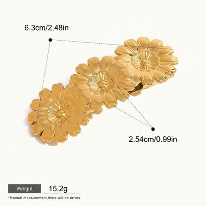 Seraphina Treasures gold metal hair clip with three daisy flower designs, glossy finish.