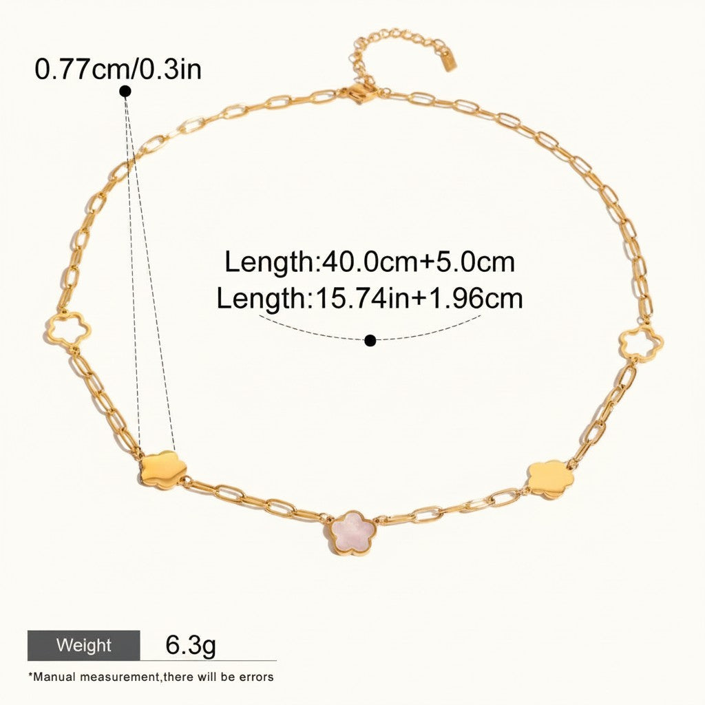 Seraphina Treasures gold-tone necklace with a delicate chain and alternating cloud and floral charms. Features a pink stone in the center of one flower charm.