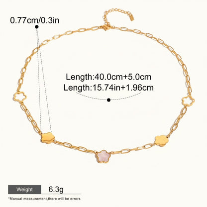 Seraphina Treasures gold-tone necklace with a delicate chain and alternating cloud and floral charms. Features a pink stone in the center of one flower charm.