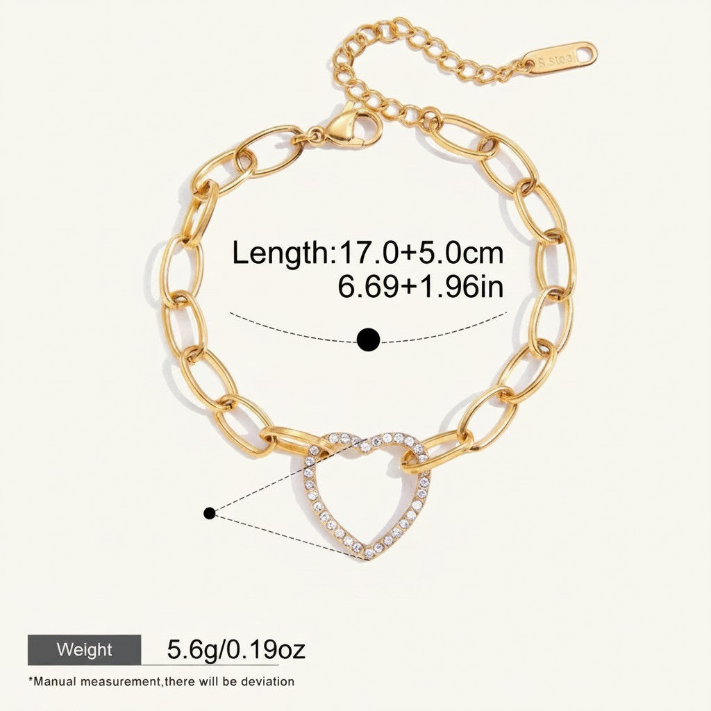 Seraphina Treasures gold-tone bracelet with a crystal-encrusted heart pendant and chunky oval links. Adjustable length.