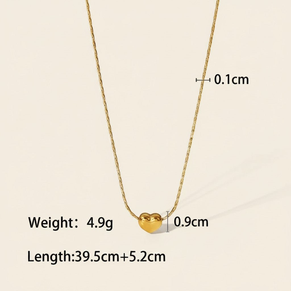Seraphina Treasures gold heart necklace with a delicate snake chain. Pendant measures 0.9cm.