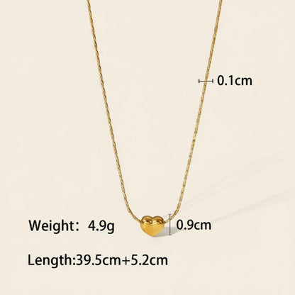 Seraphina Treasures gold heart necklace with a delicate snake chain. Pendant measures 0.9cm.