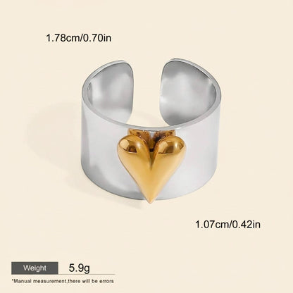Seraphina Treasures Orvara ring with a gold heart accent on a silver band. Waterproof and hypoallergenic.