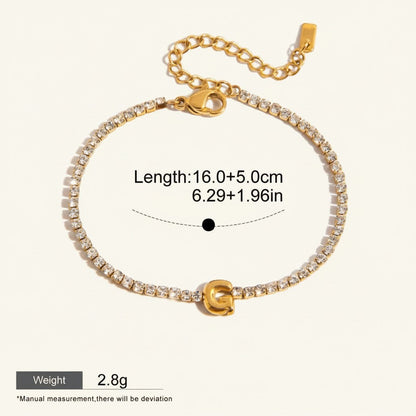 Seraphina Treasures gold-tone bracelet with clear zirconia stones and a gold initial 'G' pendant. Adjustable chain.