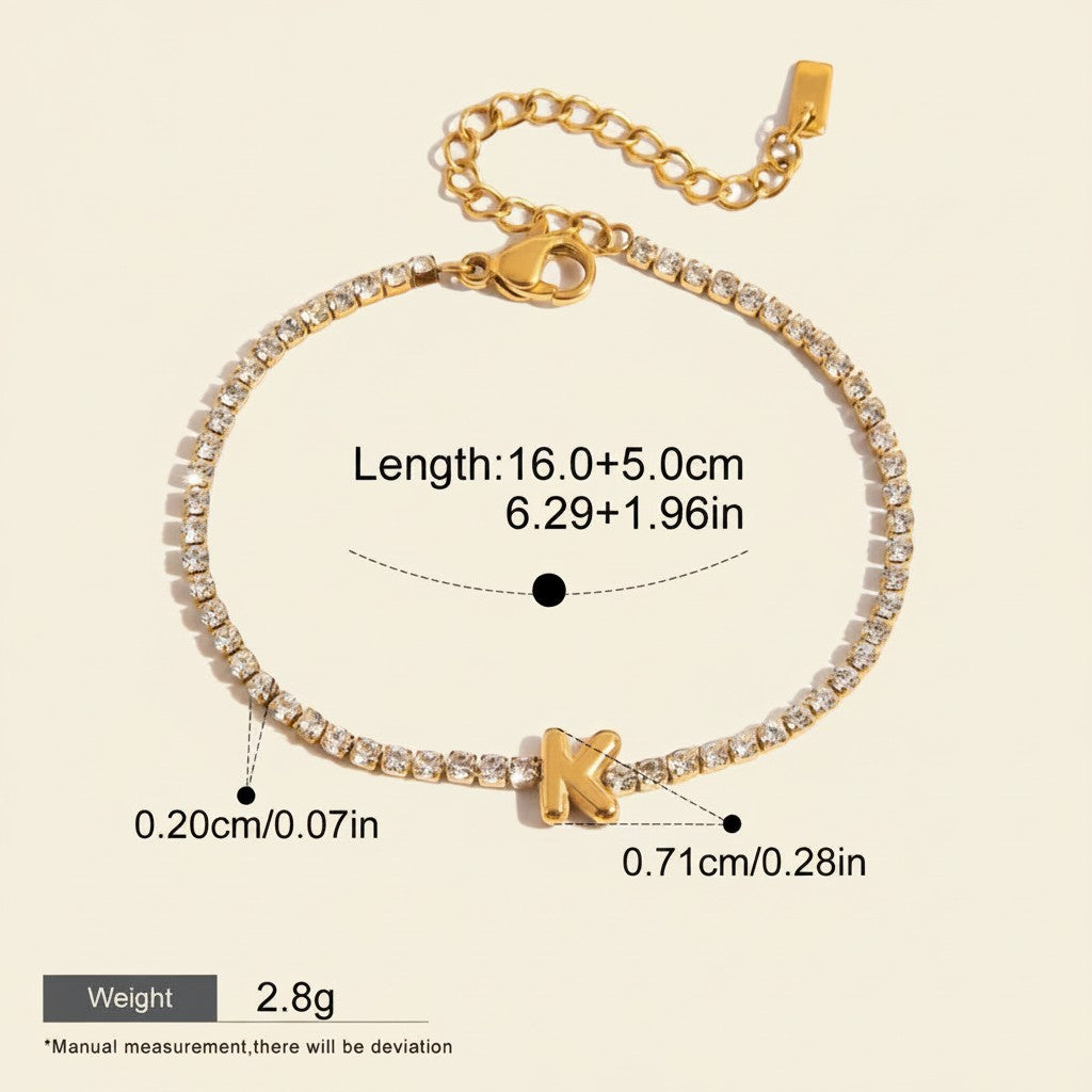 Seraphina Treasures gold-tone tennis bracelet with clear zirconia stones and a gold initial 'K' pendant. Adjustable chain.