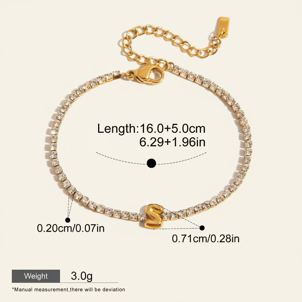 Seraphina Treasures gold-tone tennis bracelet with clear zirconia stones and a gold initial 'S' pendant.