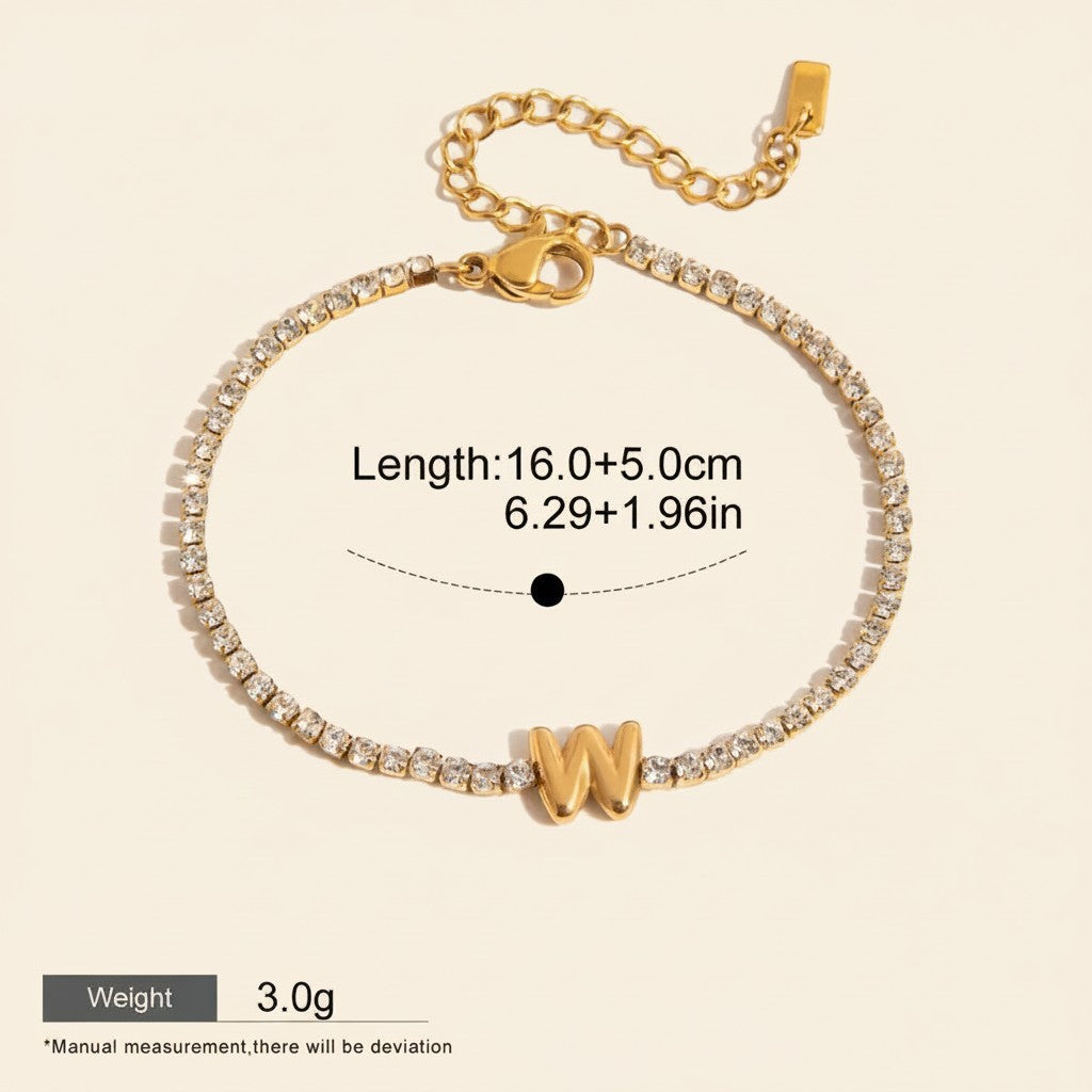 Seraphina Treasures gold-tone bracelet with clear zirconia stones and a gold 'W' initial pendant. Waterproof and hypoallergenic.