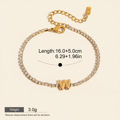 Seraphina Treasures gold-tone bracelet with clear zirconia stones and a gold 'W' initial pendant. Waterproof and hypoallergenic.