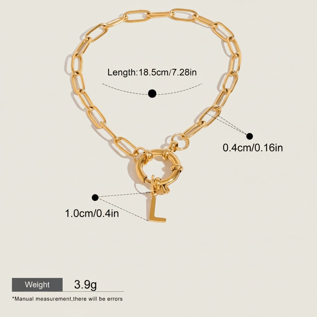 Seraphina Treasures gold-tone chain bracelet with a toggle clasp and a dangling initial 'L' charm. Waterproof and hypoallergenic.