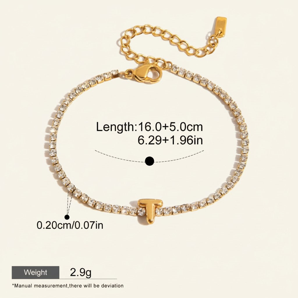 Seraphina Treasures gold-tone bracelet with clear zirconia stones and a gold letter T pendant. Adjustable length, waterproof, hypoallergenic.