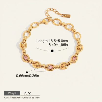 Seraphina Treasures Hestia gold-tone bracelet with oval links and pink cubic zirconia stones. Adjustable chain.