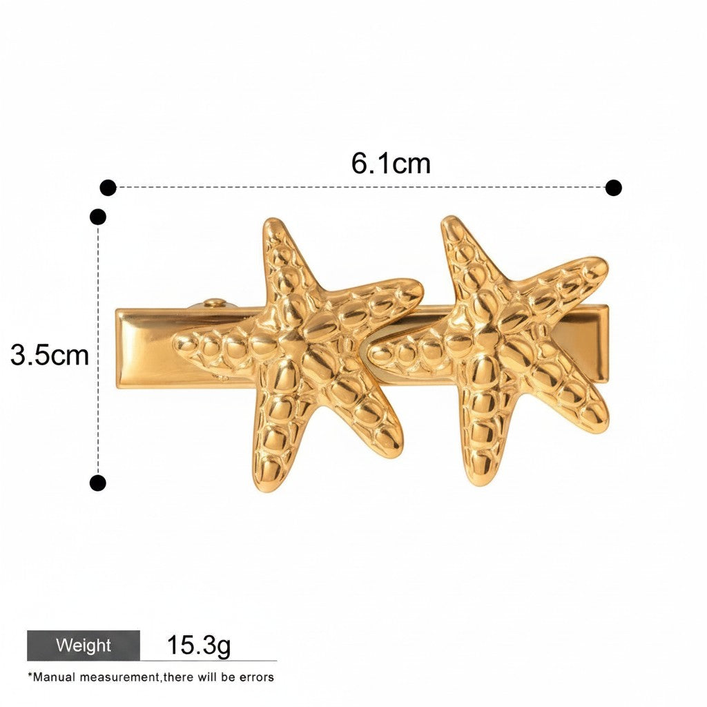 Seraphina Treasures gold-tone hair clip with two textured starfish designs, 6.1cm length.