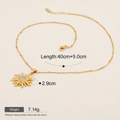 Seraphina Treasures gold sun pendant necklace with zirconia stones and beaded chain, 40cm+5cm length.