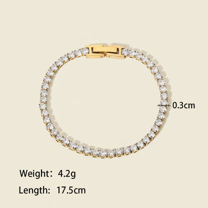 Seraphina Treasures Albina gold tennis bracelet with crystal zircon accents, 17.5cm length, 0.3cm width.