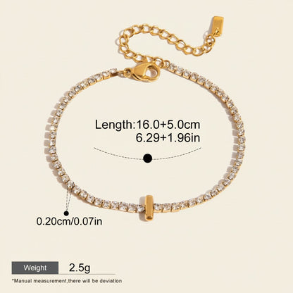 Seraphina Treasures gold-tone bracelet with clear zirconia stones and a small gold bar pendant. Adjustable chain.