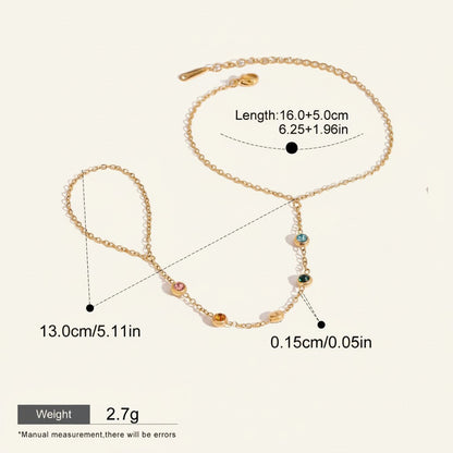 Seraphina Treasures Hecate bracelet with colorful zircon accents, gold chain, and finger loop. Waterproof and hypoallergenic.