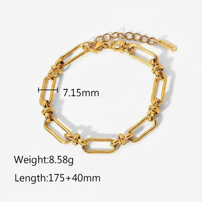 Seraphina Treasures Isolde gold-tone stainless steel link bracelet with knot details and cross clasp.