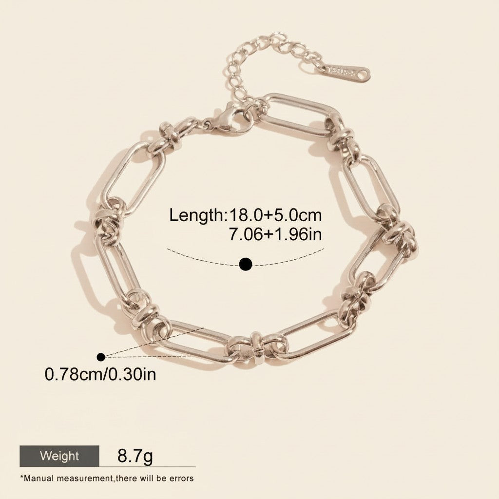 Seraphina Treasures Isolde silver-tone metal link bracelet with knot details and secure clasp. Waterproof and hypoallergenic.