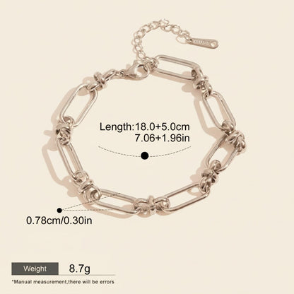 Seraphina Treasures Isolde silver-tone metal link bracelet with knot details and secure clasp. Waterproof and hypoallergenic.