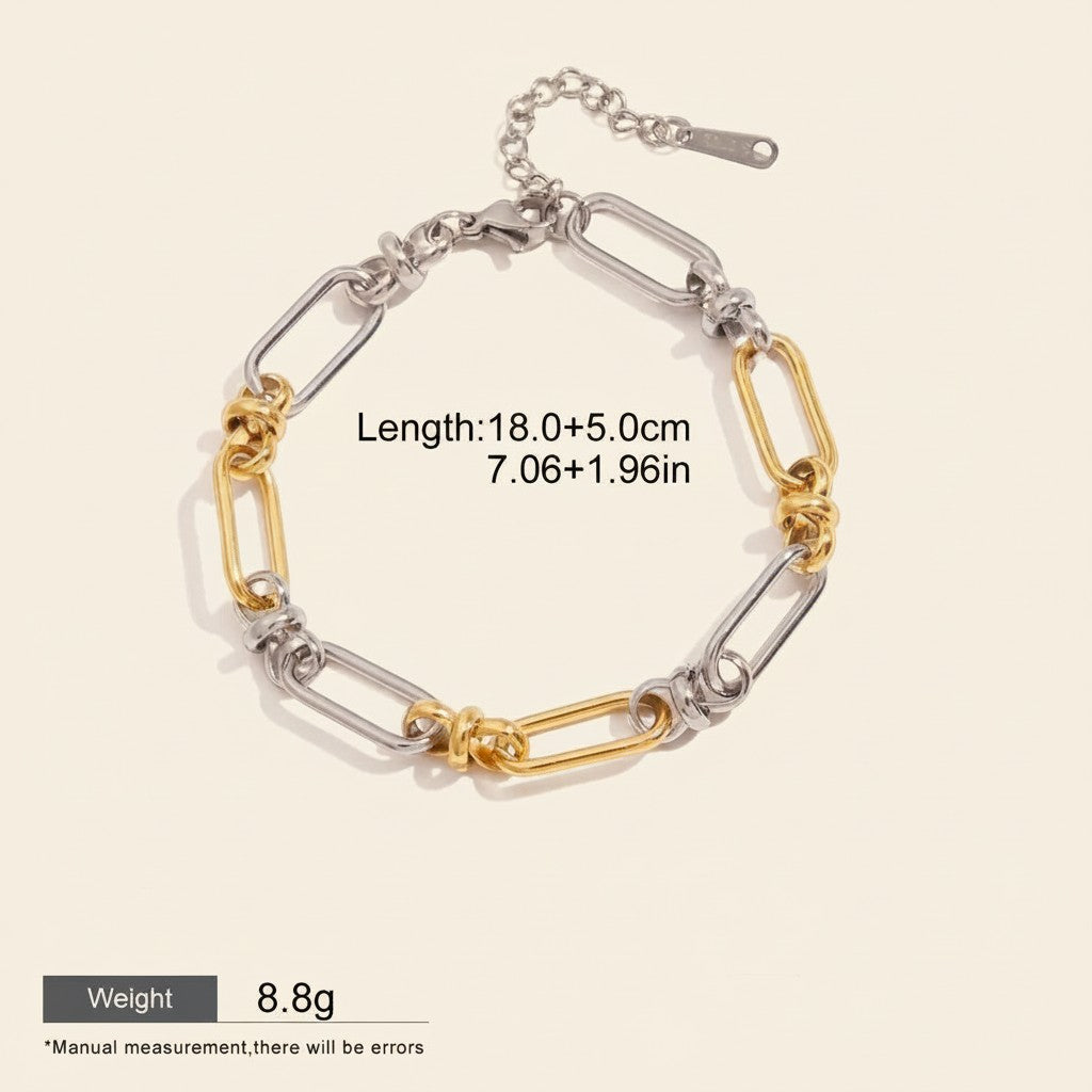 Seraphina Treasures Isolde two-tone link bracelet with cross clasp, silver and gold plated stainless steel.