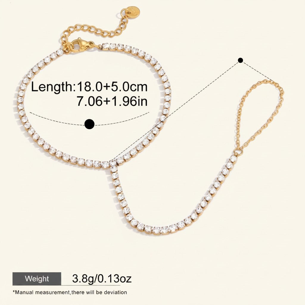 Seraphina Treasures Junia bracelet with white zirconia stones and gold-tone chain. Features adjustable length and a connected ring.