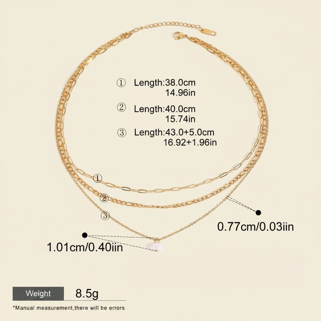 Seraphina Treasures Yasira layered gold necklace with natural pearl pendant. Features three delicate chains of varying lengths.