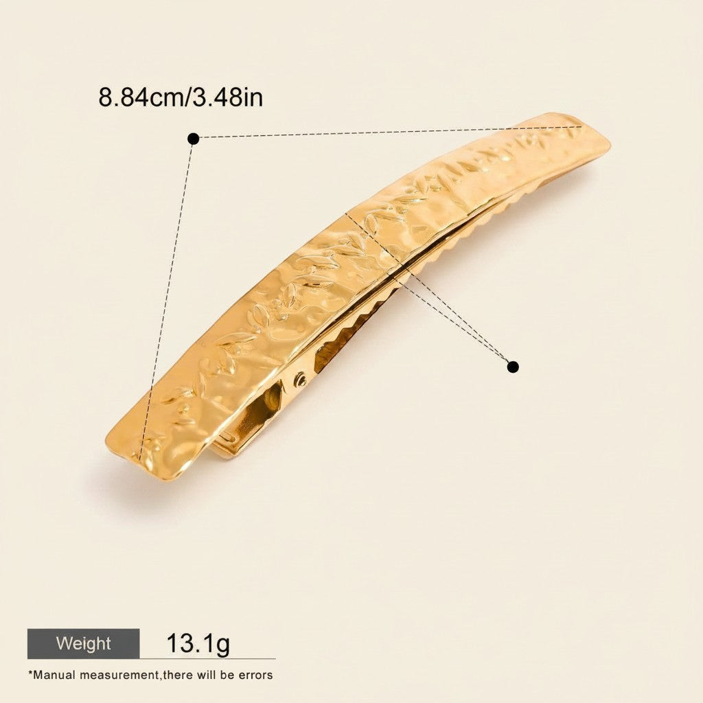 Seraphina Treasures Leonora gold hammered metal hair clip with leaf pattern. Secure hold for elegant styling.