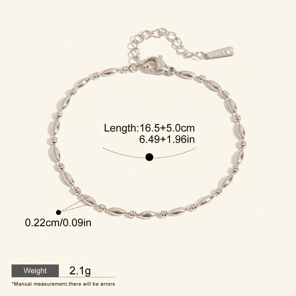 Seraphina Treasures Lumina silver-tone stainless steel bracelet with oval beads and adjustable chain.