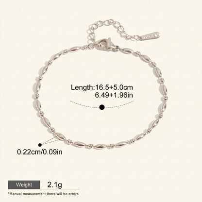 Seraphina Treasures Lumina silver-tone stainless steel bracelet with oval beads and adjustable chain.