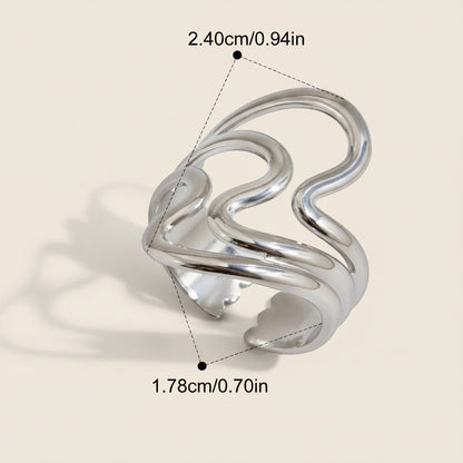 Seraphina Treasures Lyrica silver ring with irregular open design and glossy ripple texture.
