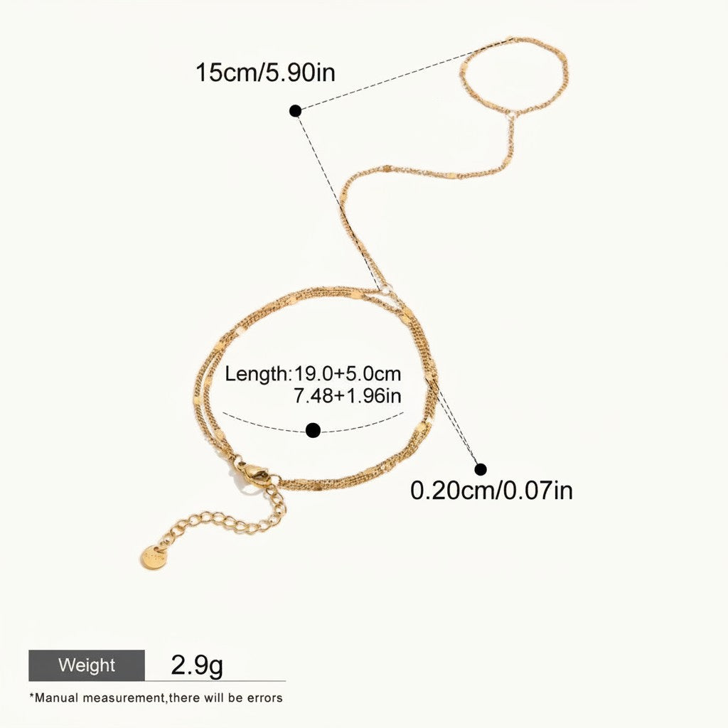 Seraphina Treasures Melia gold-tone bracelet to finger chain, delicate double strand with adjustable clasp. Waterproof and hypoallergenic.