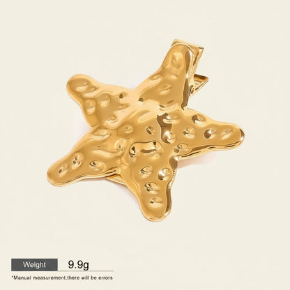 Seraphina Treasures Nyx gold hammered sea star hairpin. Elegant hair accessory with a unique textured finish.