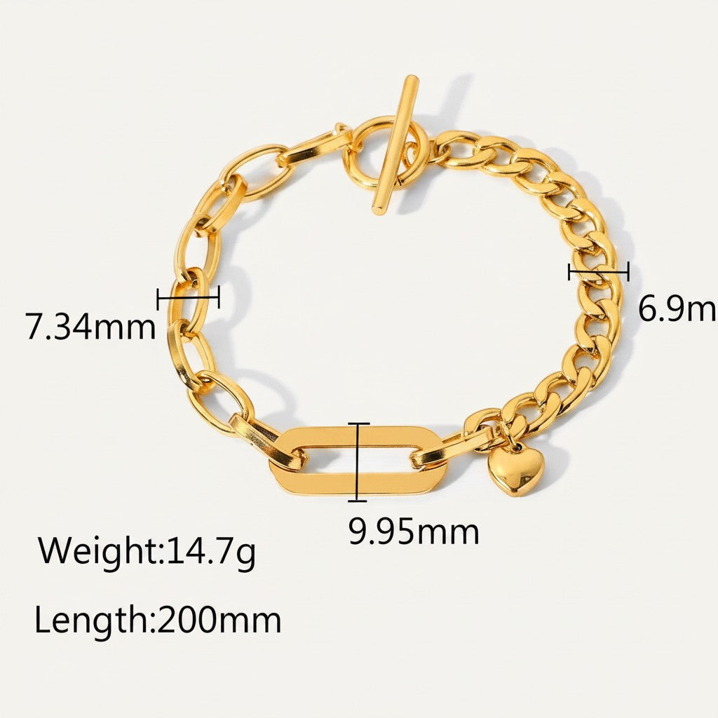 Seraphina Treasures Rhea gold-tone stainless steel bracelet with toggle clasp and heart charm. Features mixed chain links and a central rectangular link.