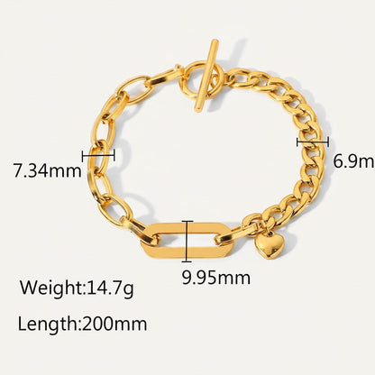Seraphina Treasures Rhea gold-tone stainless steel bracelet with toggle clasp and heart charm. Features mixed chain links and a central rectangular link.