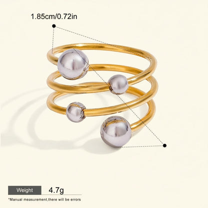 Seraphina Treasures Selenis ring with layered gold-tone metal and silver beads. Waterproof and hypoallergenic.