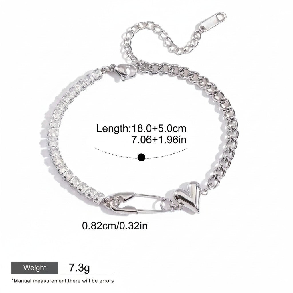 Seraphina Treasures silver bracelet with cubic zirconia, safety pin, and heart charm. Adjustable length.