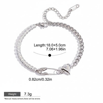 Seraphina Treasures silver bracelet with cubic zirconia, safety pin, and heart charm. Adjustable length.